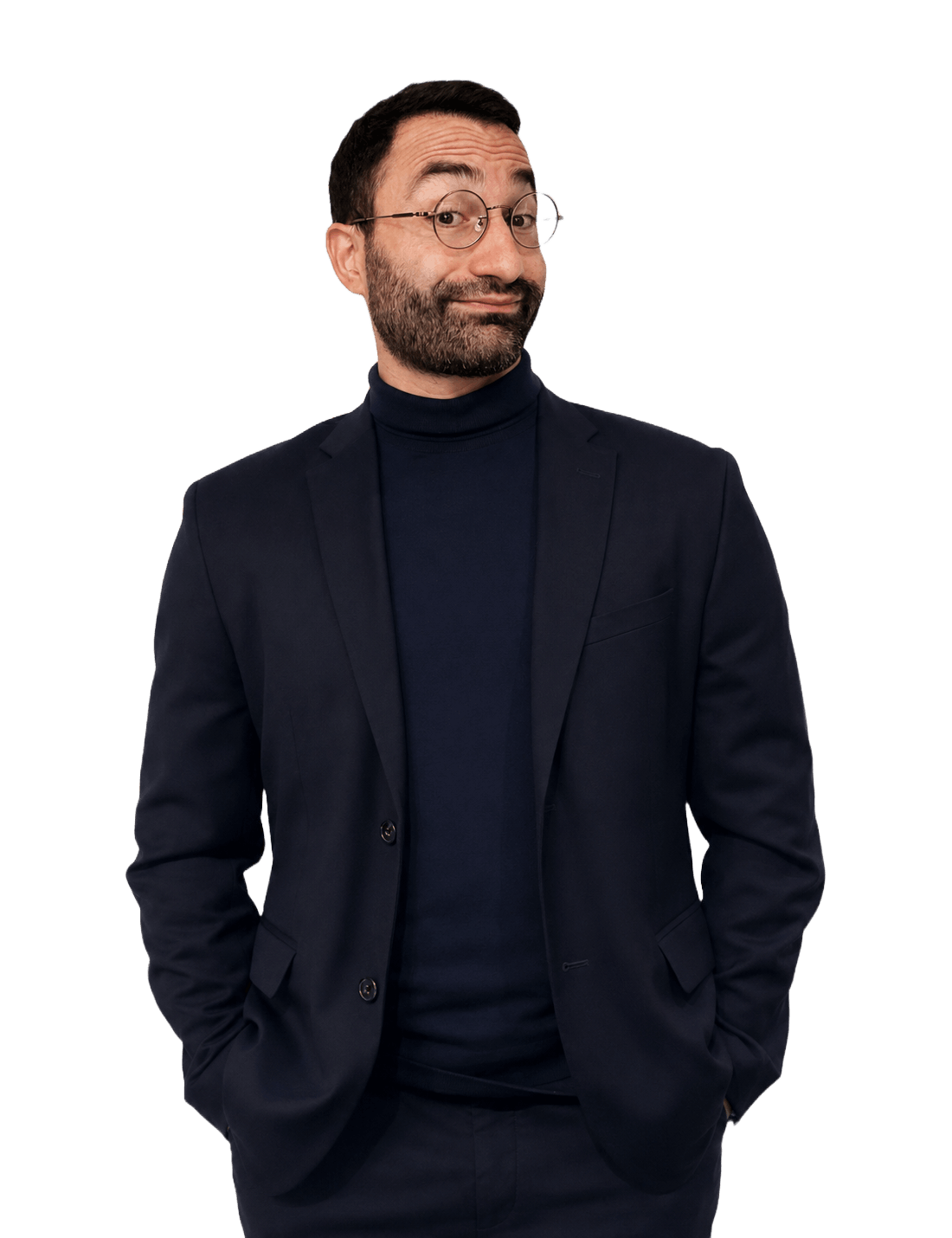 A friendly portrait of Francesco in a navy suit and turtleneck, with a light shrug and a wry smile.